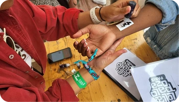 Festival wristbands being applied at event entry